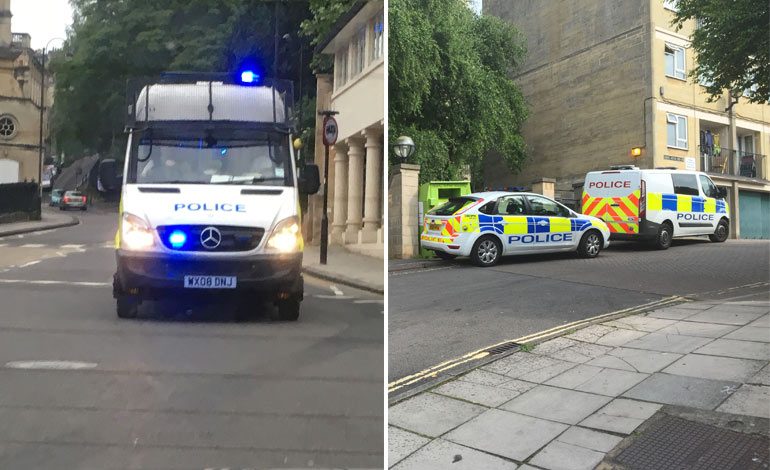 Left: A police van on the way to the raid at 6am. Right: Police vehicles parked up just off the London Road.
