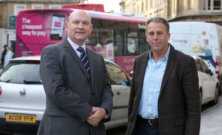 Tim Bowles standing with Tim Warren in the centre of Bath