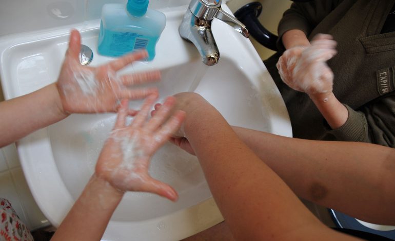 People washing this hands to avoid Norovirus
